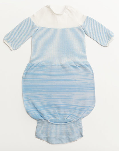 A blue transition swaddle.