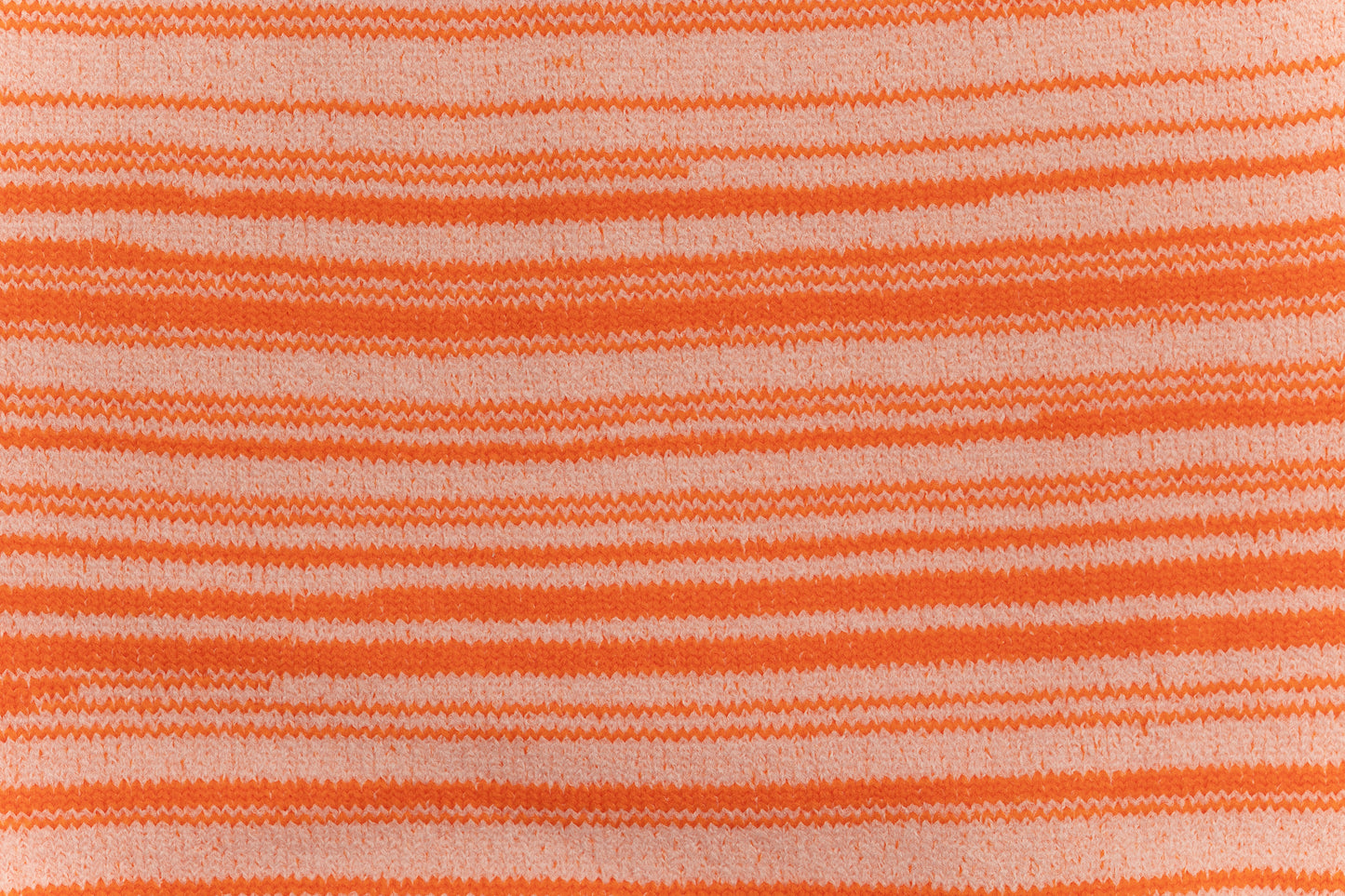 A close up of the arms out swaddle.