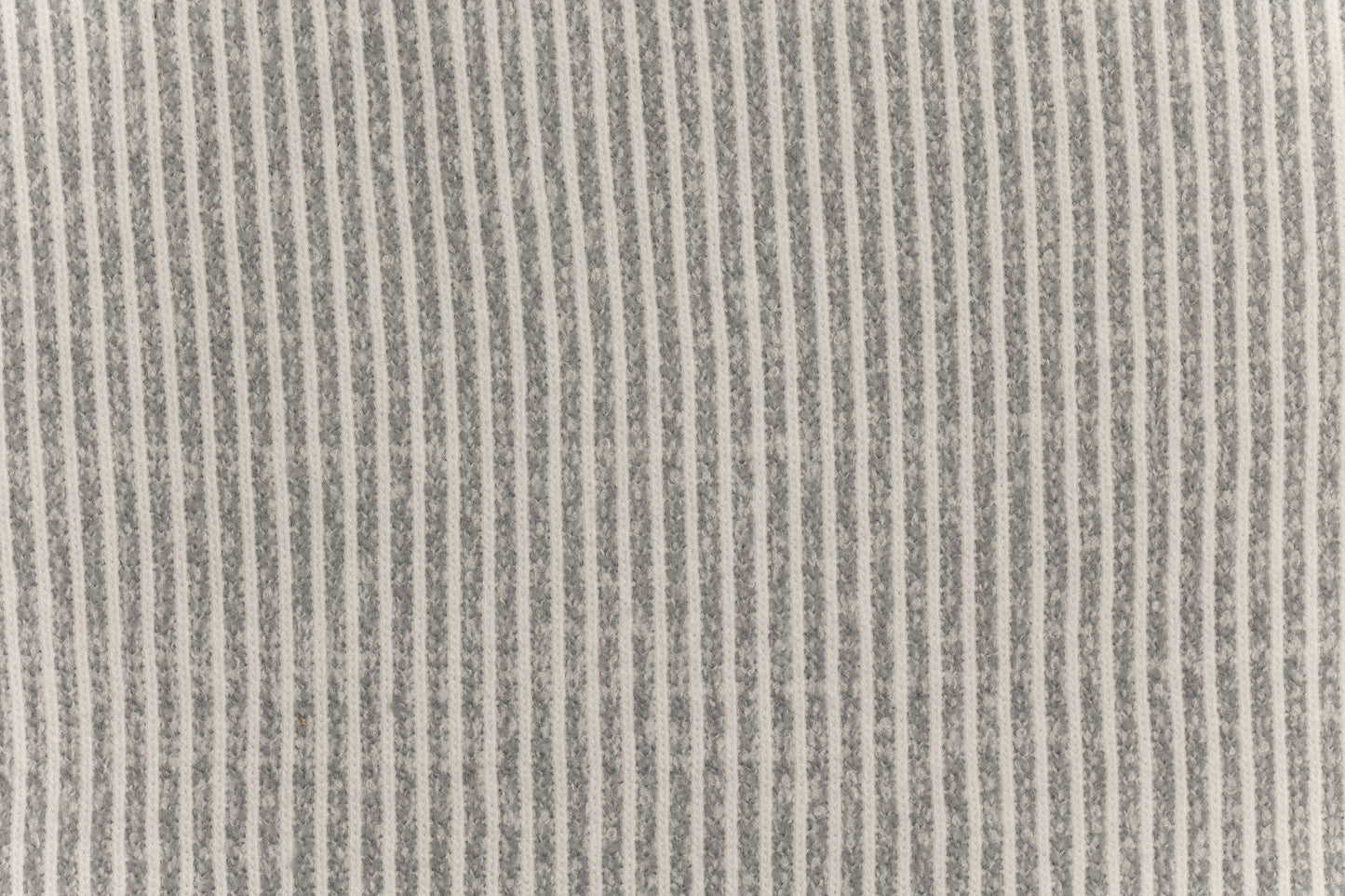 A fabric swatch of a knit baby swaddle.