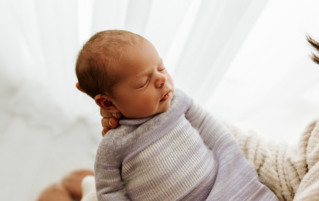 baby lying in a swaddle