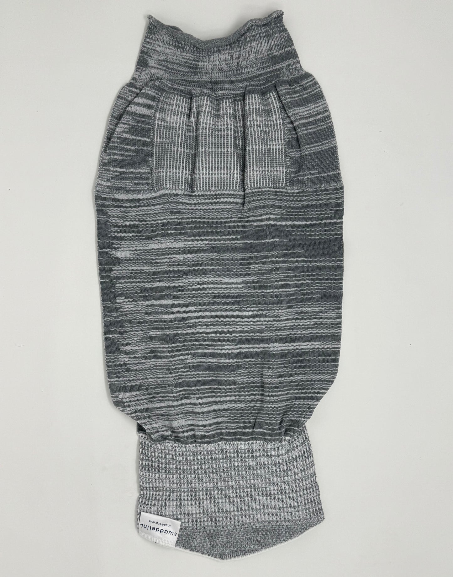 The Grey Swaddelini Sleep Sack Bundle is your complete safe sleep system — from newborn swaddle to arms-out sleep sack. Perfect for rolling babies