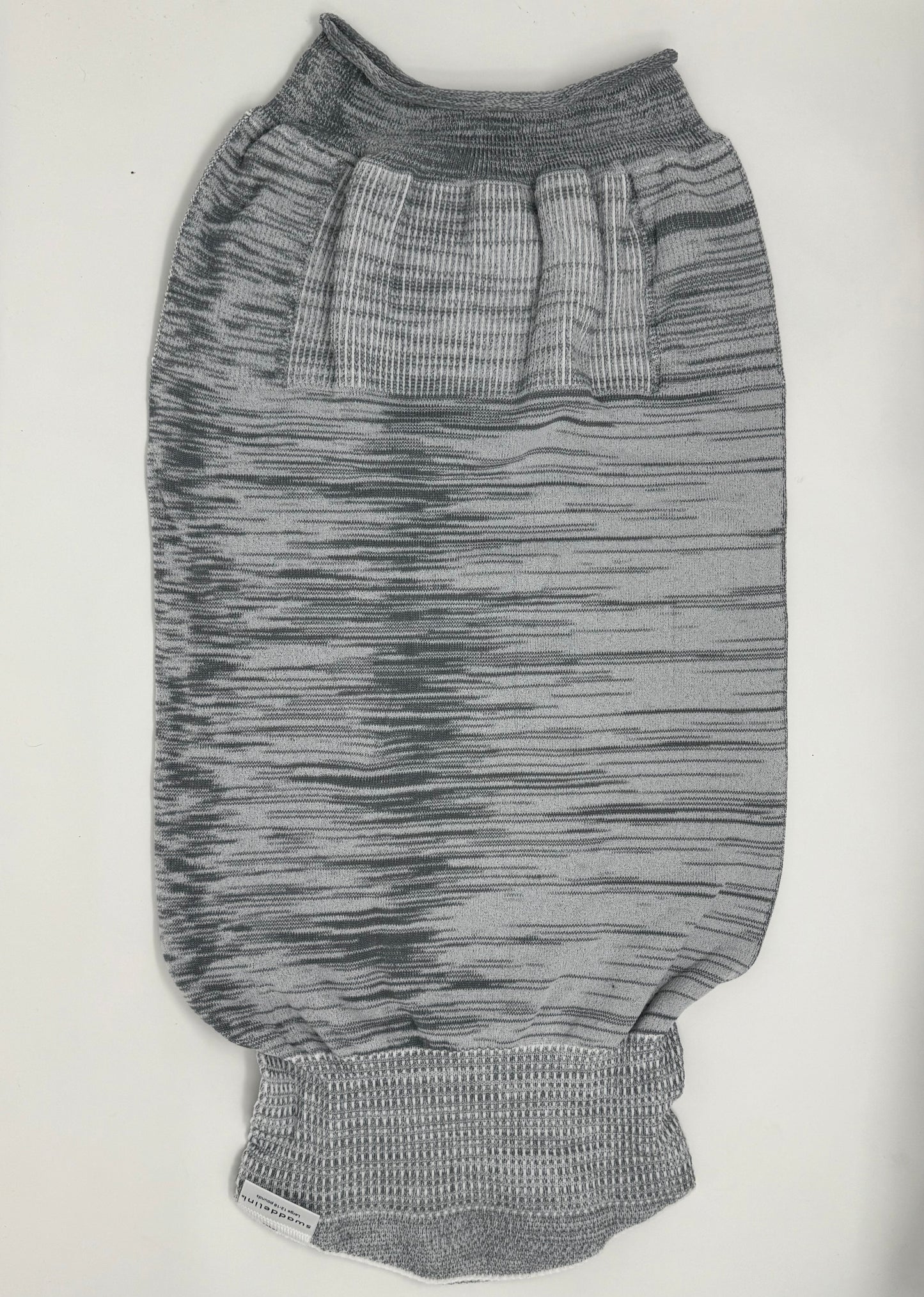 The Grey Swaddelini Sleep Sack Bundle is your complete safe sleep system — from newborn swaddle to arms-out sleep sack. Perfect for rolling babies