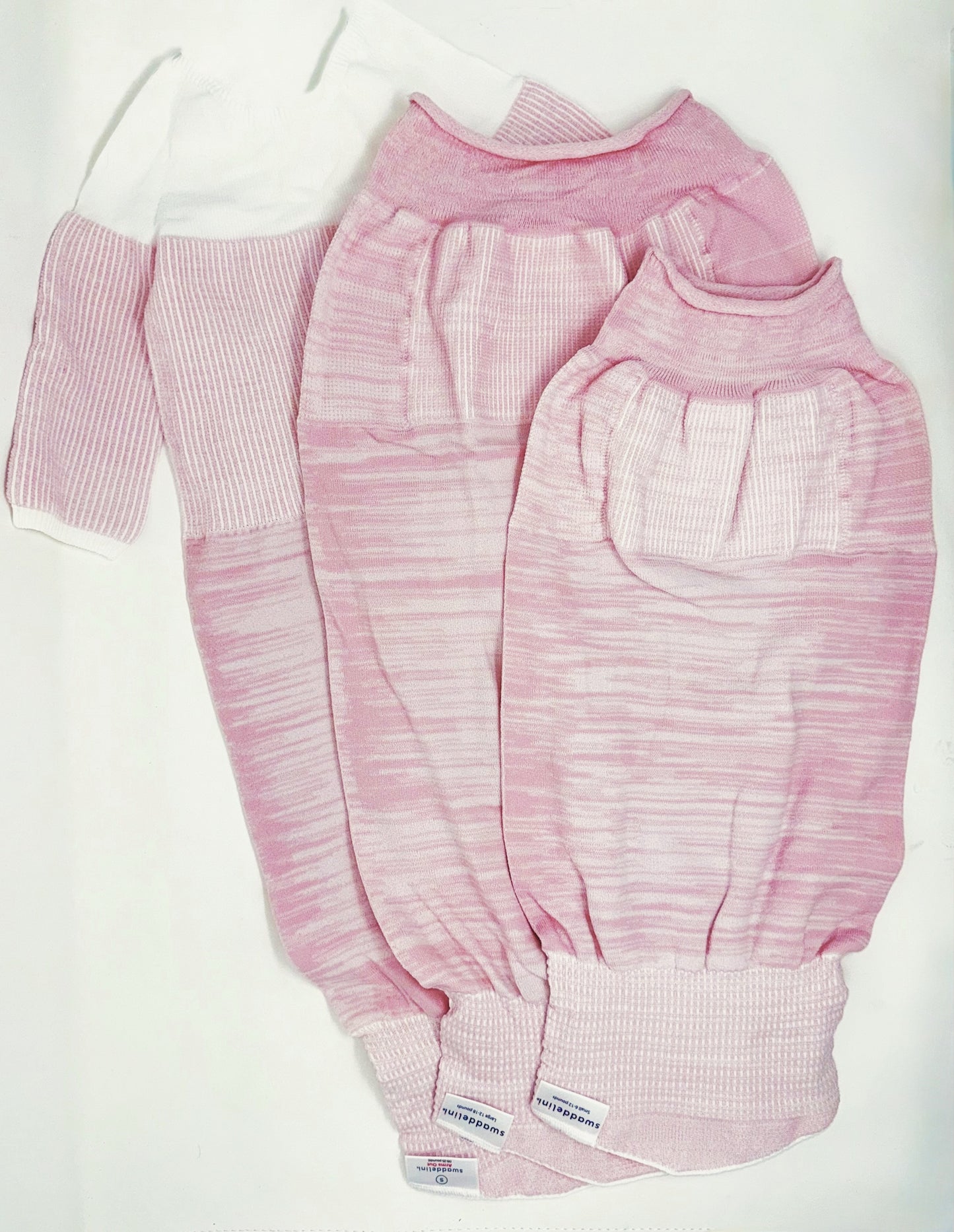 Help your baby girl sleep safely and soundly with the Pink Swaddelini Sleep Sack Bundle — a complete 3-stage system from newborn swaddle to arms-out sleep sack for rolling babies.