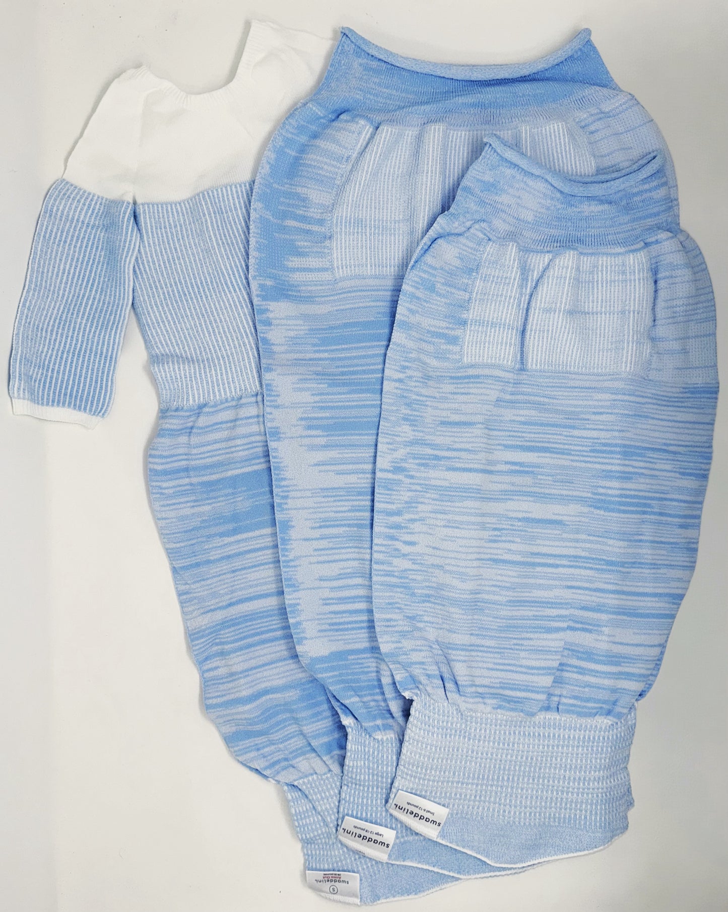 Help your baby boy sleep safely and soundly with the Blue Swaddelini Sleep Sack Bundle — a complete 3-stage system from newborn swaddle to arms-out sleep sack for rolling babies.