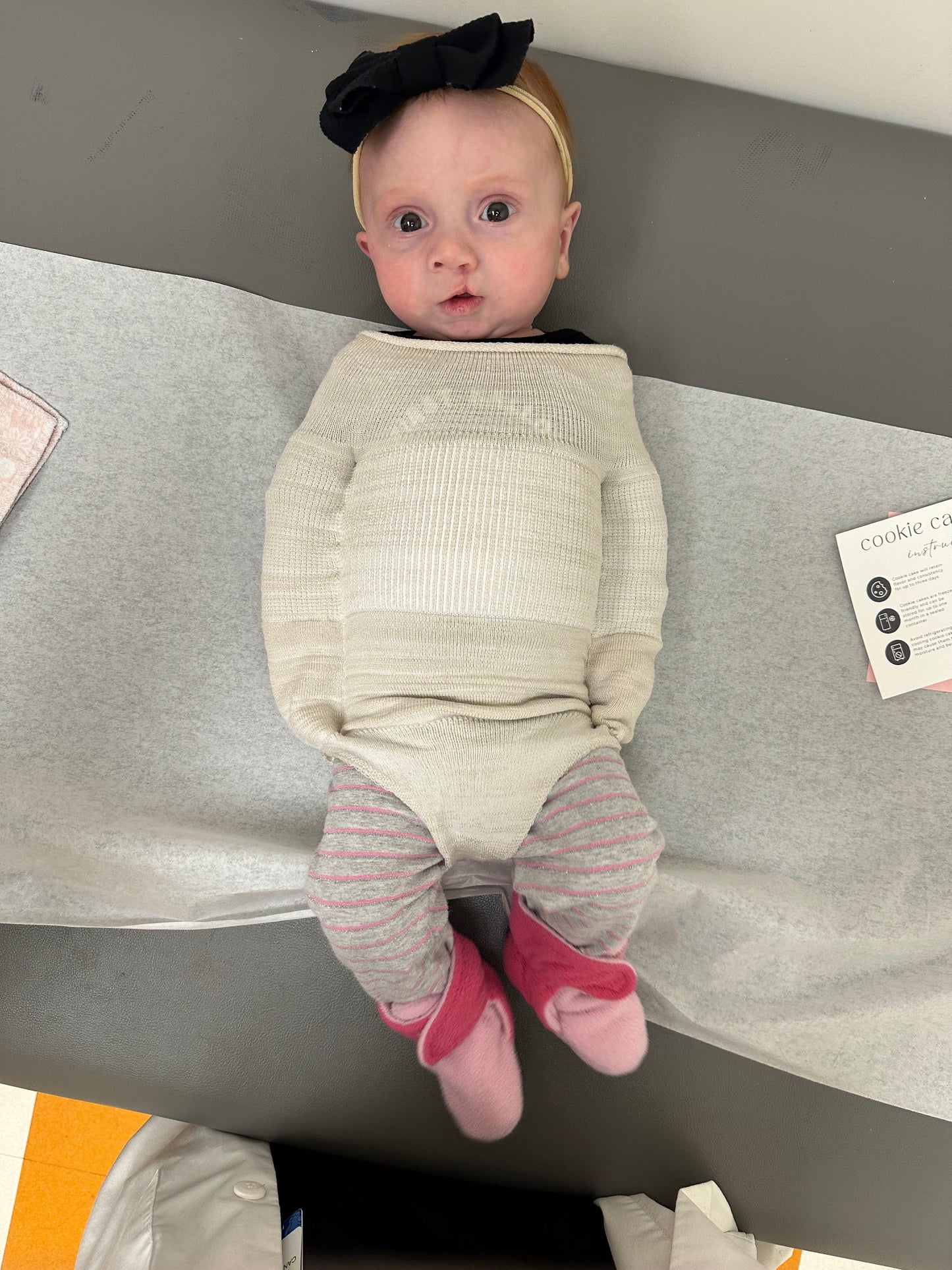 Discover the Swaddelini® Post-Surgery Swaddle — a soft, medical-grade alternative to nono sleeves. Co-designed by Dr. Jessica Canallatos to support cleft-lip recovery, safe sleep, and happy healing.
