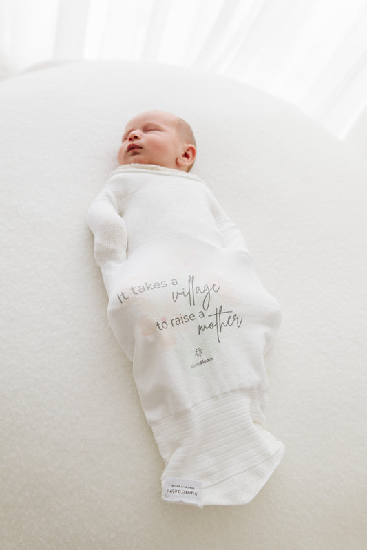 baby sleeping in safe sleepsack with good message to new mothers