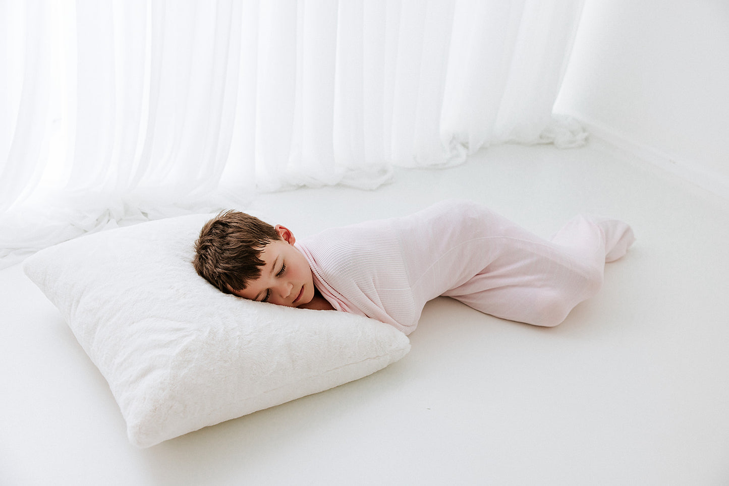 big kid pink sleep sack with passive compression for sensory sensitive kid