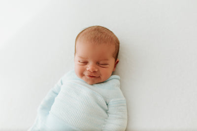 sleeping baby smiles 